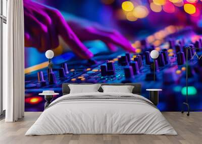 DJ adjusting a vibrant audio mixer with colorful neon lights, creating an electrifying atmosphere during a live music event Wall mural