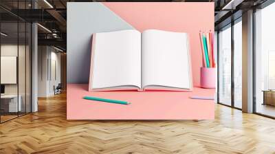 Overhead mockup of open kids book on table with pencils. Pastel colors theme. Wall mural