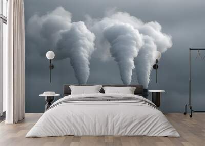 Three industrial chimneys spewing white smoke into a cloudy sky. Wall mural