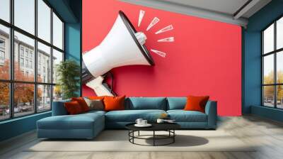 White megaphone on red background with copy space. Wall mural