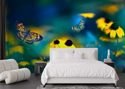 Tropical butterflies and yellow bright summer flowers on a background of colorful  foliage in a fairy garden. Macro artistic image. Banner format. Wall mural