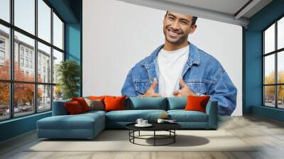 Two thumbs up for you. Cropped portrait of a handsome young man giving thumbs up in studio against a grey background. Wall mural