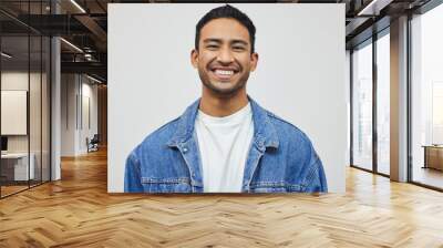 Its a good day to smile. Cropped portrait of a handsome young man posing in studio against a grey background. Wall mural