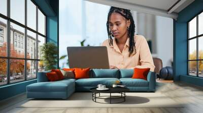 Black woman, laptop and typing online email communication, planning strategy and working in home office. African girl, remote worker and data analysis on digital tech device for web ux management Wall mural