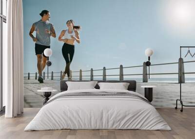 Couple, fitness and running by beach on mockup for exercise, workout or cardio routine together. Happy man and woman runner taking a walk or jog for healthy wellness or exercising in Cape Town Wall mural