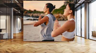 Couple, prayer hands and yoga meditation at beach outdoors for health and wellness. Sunset, pilates fitness and man and woman with namaste hand pose for training, calm peace and mindfulness exercise Wall mural