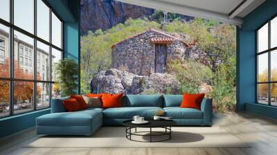 Stone shack in the mountains Wall mural