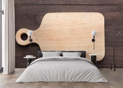 Cutting board on the wooden background. Top view Wall mural