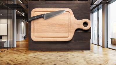 Knife and cutting board on the wooden background Wall mural