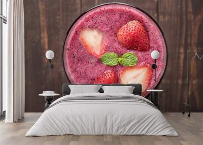 Strawberry smoothie in glass on wooden background Wall mural