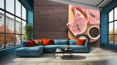 top view raw pork chop steak and garlic, pepper on wooden backgr Wall mural