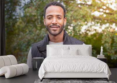 Portrait of an African American man smiling looking confident and joyful at camera. Shot in slow-motion with RED camera. High quality photo Wall mural