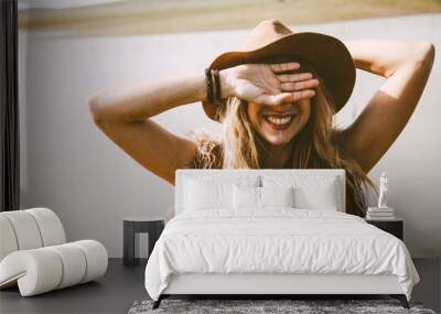 close up of a boho blonde girl outdoors in a sunny day Wall mural