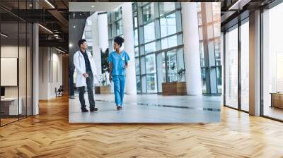 Are you ready for this procedure. Shot of medical practitioners having a conversation in a hospital. Wall mural