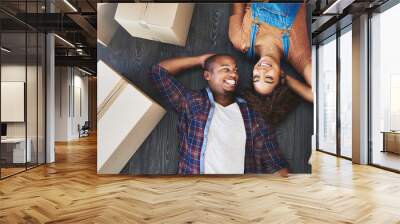 Completely happy at their new place. Shot of an attractive young couple moving house. Wall mural