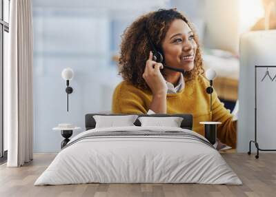 Her display of care in customers is great business. Shot of a female agent working in a call centre. Wall mural