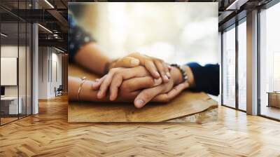 Holding hands, support and comfort of two people talking through a difficult problem. Closeup of friends showing care and love through a hard time, consoling each other and bonding Wall mural