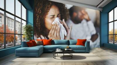 Ill or sick woman with allergy, sinus infection sneezing in tissue or blowing nose during flu season at home. Sick girl caught a bad cold showing symptoms of covid, or suffering from a virus disease Wall mural