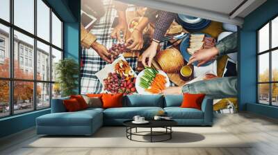 Life is a picnic. Shot of a group of unidentifiable friends eating at a picnic. Wall mural