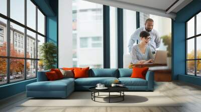 Looks great. Cropped shot of two businesspeople working together in the office. Wall mural