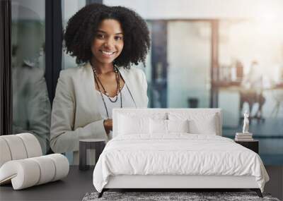 Make it your business to be tech savvy and industrious. Portrait of a young businesswoman smiling and holding a digital tablet in her office. Wall mural