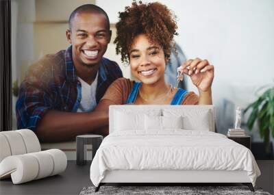 Starting our future together with this key. Shot of an attractive young couple moving house. Wall mural