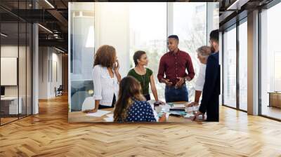 When your team works, your ideas will. Shot of creative employees working in a modern office. Wall mural