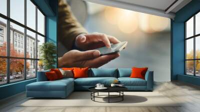 Wireless is the way to go. High angle shot of an unrecognizable businessman using a mobile phone. Wall mural