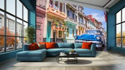 Blue vintage classic american car in a colorful street of Havana, Cuba. Travel and tourism concept. Wall mural