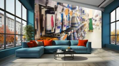 Blurred background of school supplies in a supermarket, back to school concept Wall mural