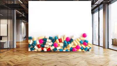 Colorful pills and medication on white background with copy space, health and medication concept Wall mural