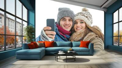 Happy young white couple wearing warm clothes and knitted hats taking a selfie during winter trip holidays, isolated on transparent background, png Wall mural