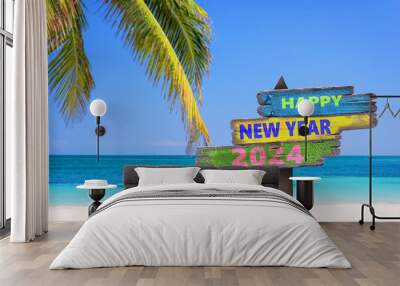 Hapy new year 2024 written on direction signs, tropical beach background, travel and tourism greeting card Wall mural