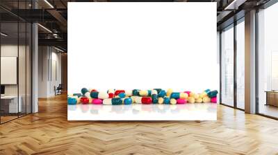 Line of colorful pills and medication on white background with copy space, health and medication concept Wall mural