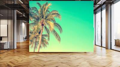 Palm tree on blue sky background with copy space, vintage style Wall mural