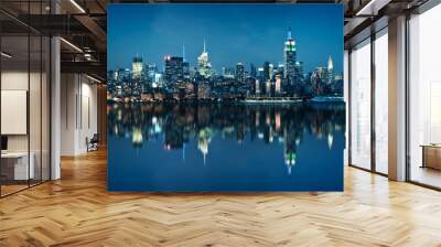 Panorama of the skyline of Manhattan, view from Jersey city during the blue hour. New York City skyline  with the Empire State building at night with  water reflections. Wall mural