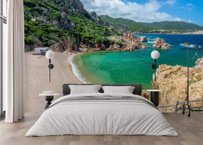 View of  Cala Li Cossi sandy beach, scenic cove in the mediterranean coast and sea with beautiful rocks in clear water in Costa Paradiso, Sardinia landscape Wall mural