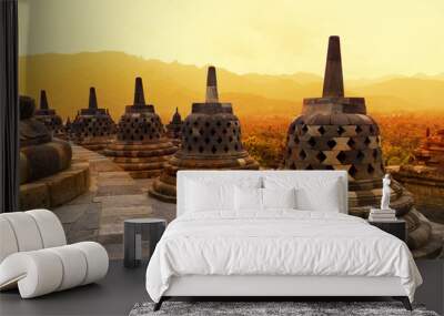 Borobudur Temple at sunset. Ancient stupas of Borobudur Temple. Wall mural