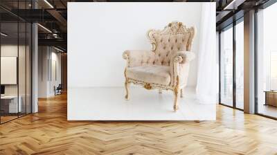 vintage armchair against white wall in white room. space for your copy Wall mural