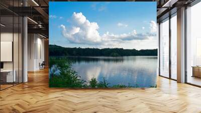 Cumulus clouds and their reflections slowly drift over scenic view at Horn Pond in Woburn, Massachusetts. -01 Wall mural