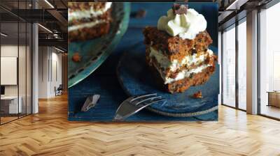 A piece of carrot cake with cream on a rustic plate Wall mural