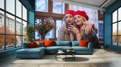 Girlfriens. Two beautiful fashionable women in retro style .. Wall mural