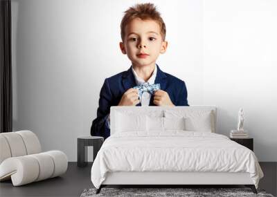 Portrait of a boy in a classic suit with a bow tie. Wall mural