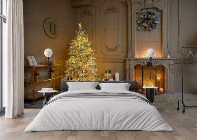 Room decorated to christmas celebration rental studio. Room decorated to christmas celebration studio. White Christmas tree with white and gold balls in a dark room with a decorative fireplace and can Wall mural