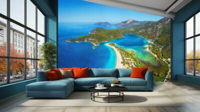 Amazing aerial view of Blue Lagoon in Oludeniz, Turkey. Summer landscape with mountains, green forest, azure water, sandy beach and blue sky in bright sunny day. Travel background. Top view. Nature Wall mural