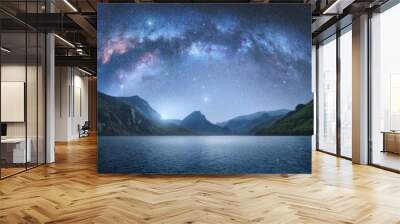 Arched Milky Way over the beautiful mountains and blue sea at night in summer. Colorful landscape with bright starry sky with Milky Way arch, moonlight, constellation, water. Galaxy. Nature and space Wall mural