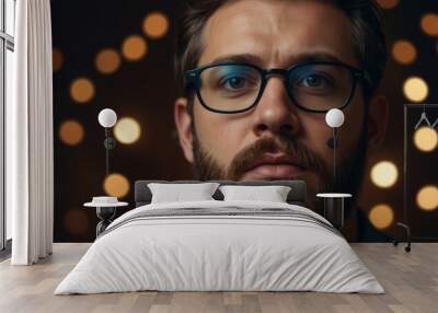 A man with a beard and glasses looking up at the camera,. Wall mural