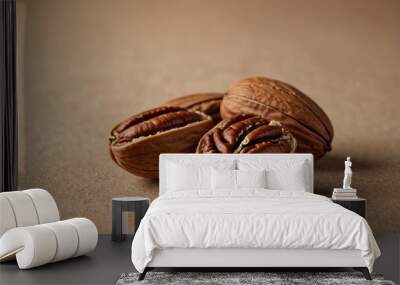 Pecan nut on a beige background, close-up Minimalist food concept. Wall mural