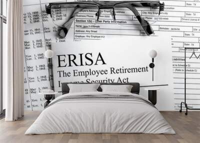 Paper with text ERISA on a financial table with eyeglasses and metal pen Wall mural