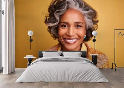 Close-up photo of a smiling middle-aged black woman with gray hair wearing a casual shirt Wall mural